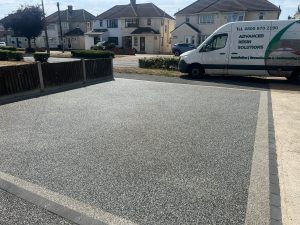 Finished resin driveway in Romford after repairs, cleaning, and resealing, showing smooth, clean surface and refreshed colour