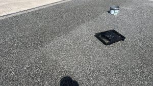 Resin-bound driveway being resealed in Romford with UV-stable topcoat for enhanced appearance and durability
