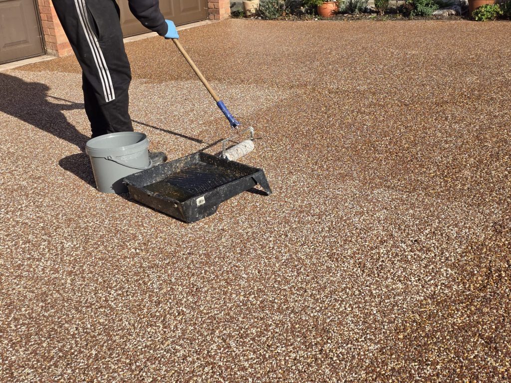 Resin driveway colour restored after professional cleaning and polyurethane resealing